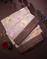 Soft Zari Kota Saree with Pastel Floral Butas and Chocolate Border